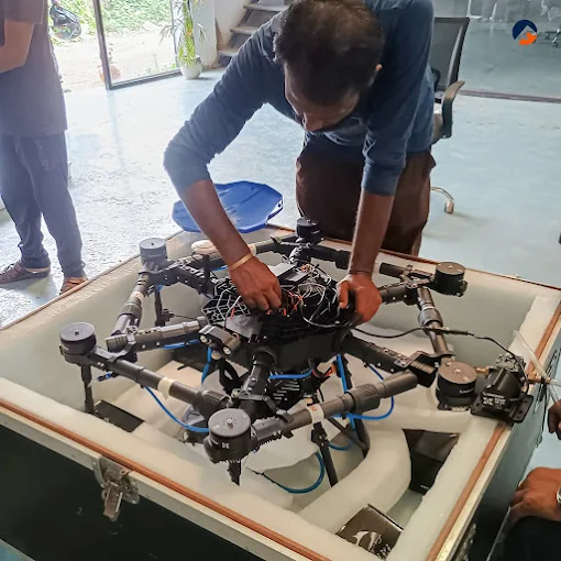 Flycast engineer checking a drone