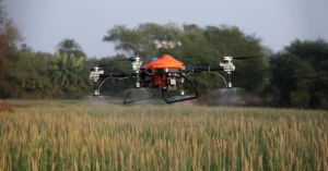 Flycast agriculture drone spraying pesticide on farmland near Kolkata